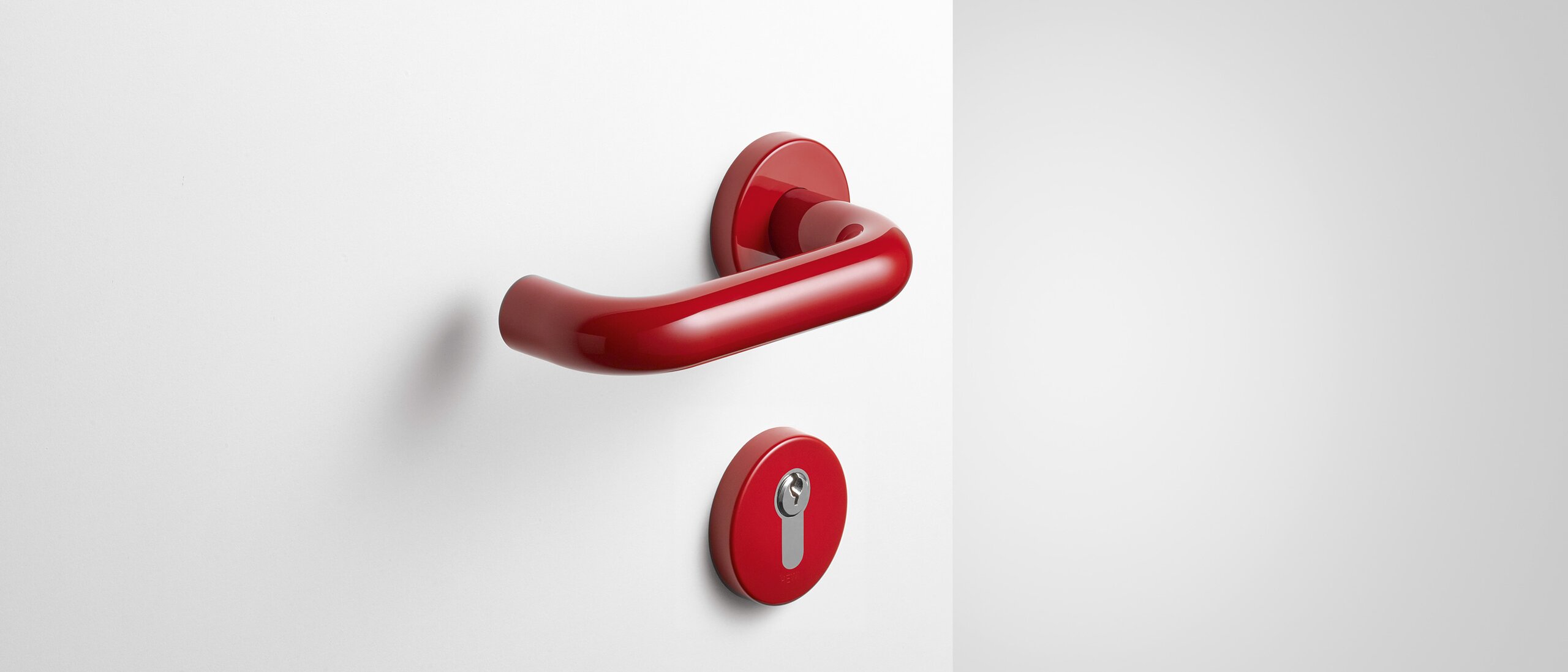 Lever handle with key rosette in the color ruby red made of polyamide