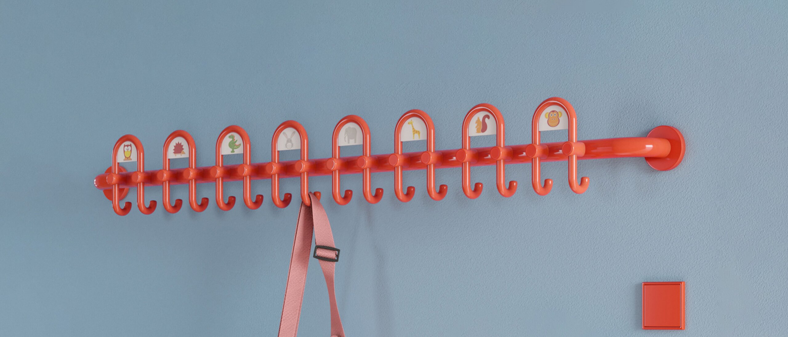 Colourful kindergarten equipped with fittings and wardrobe in the colour orange