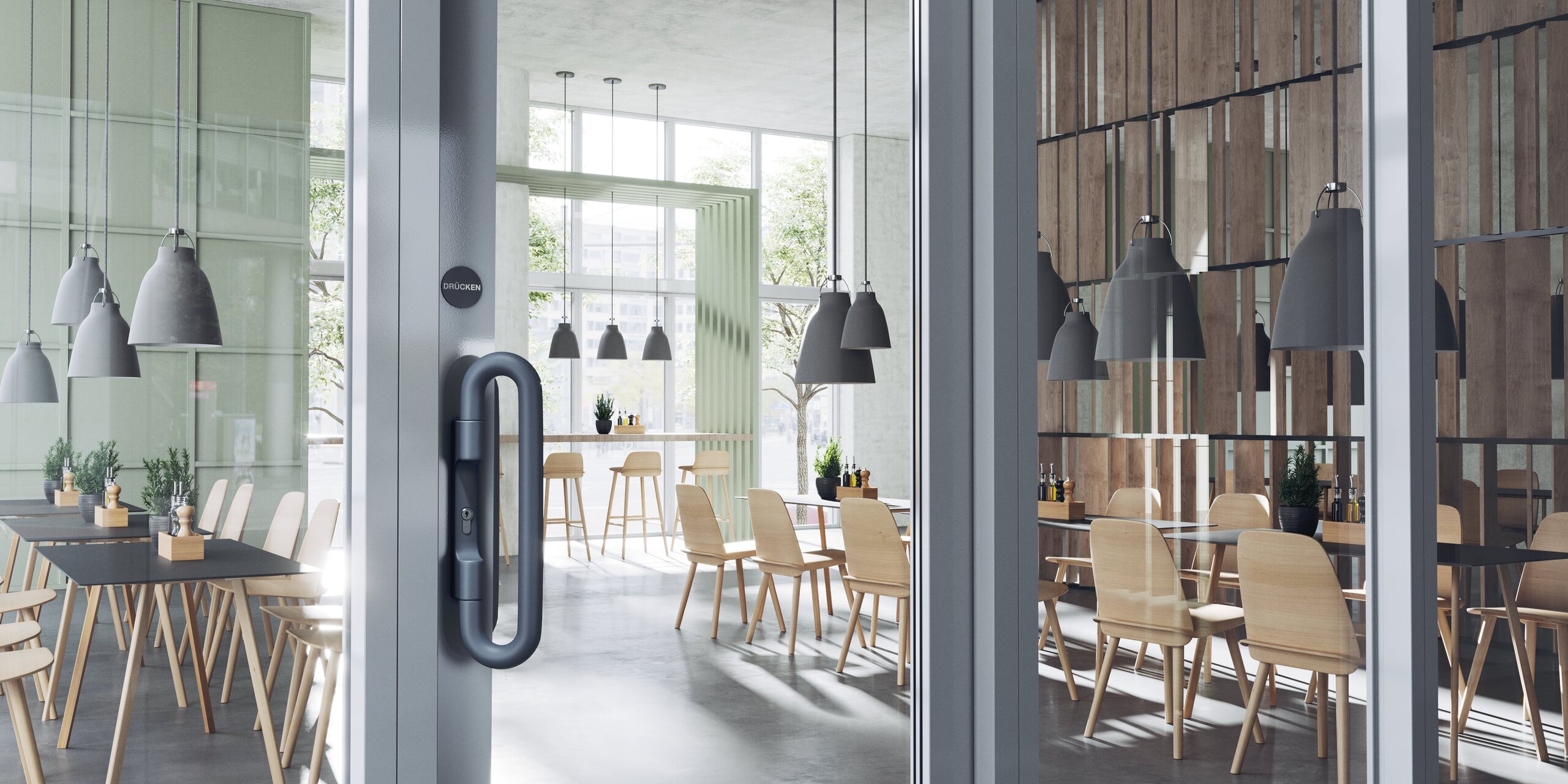 A dark grey door handle on a double glass door in a catering area