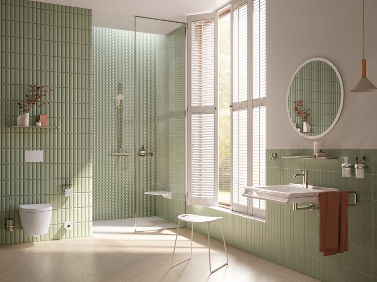 Accessible, eco-friendly bathroom with a stool by the wheelchair-accessible washbasin and a hinged seat in the shower