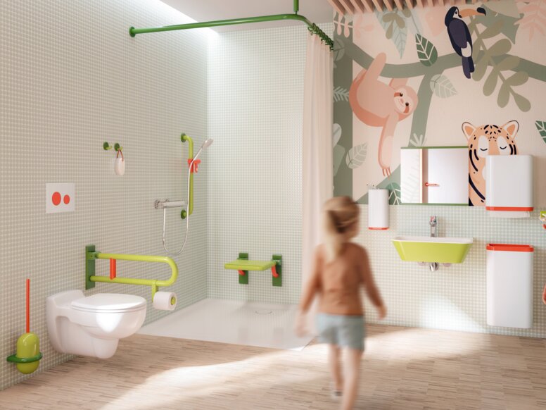 HEWI Range 801 ICONIC Interior Children’s bathroom with a wall-mounted WC, a hinged grab rail in coloured colours, a coloured washbasin and a hinged shower seat