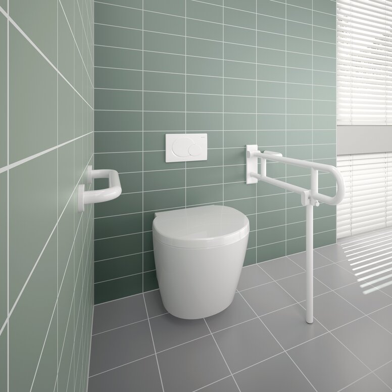 HEWI Range 801 Hinged Support Rail for People with Obesity A white hinged support rail and grab rail fitted next to a white WC against a light green tiled wall