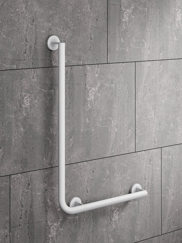 HEWI System 900 shower handrail White powder-coated L-shaped support rail on a grey wall