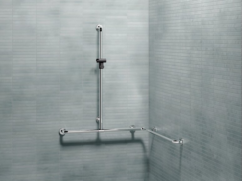 L-shaped support rail with a vertical shower rail and shower head holder on a tiled wall in the shower area