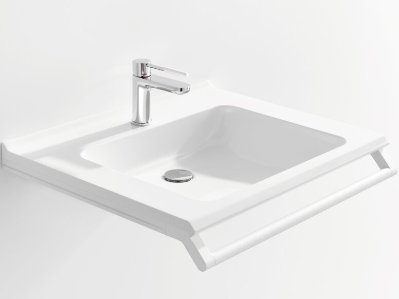 White washbasin with a rectangular bowl, a chrome-plated tap and a support rail along the front edge