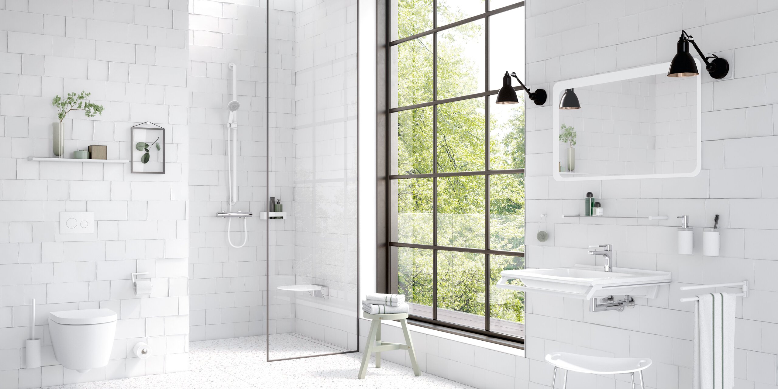 Bright bathroom with white wall tiles, a level-access shower behind a glass partition, a wall-hung toilet and a white washbasin beneath a mirror, complemented by white grab rails and a large black-framed grid window