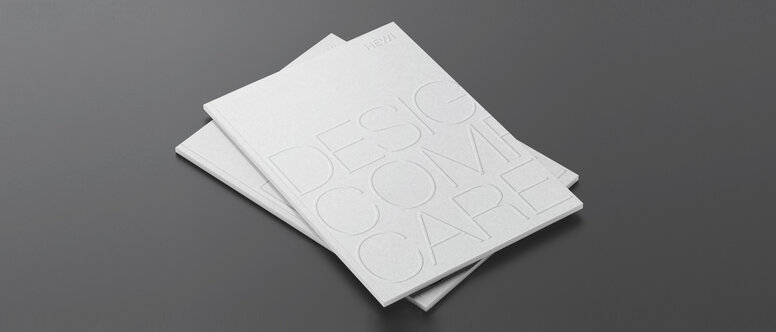Design Comfort Care Two stacked brochures with the inscription Design Comfort Care