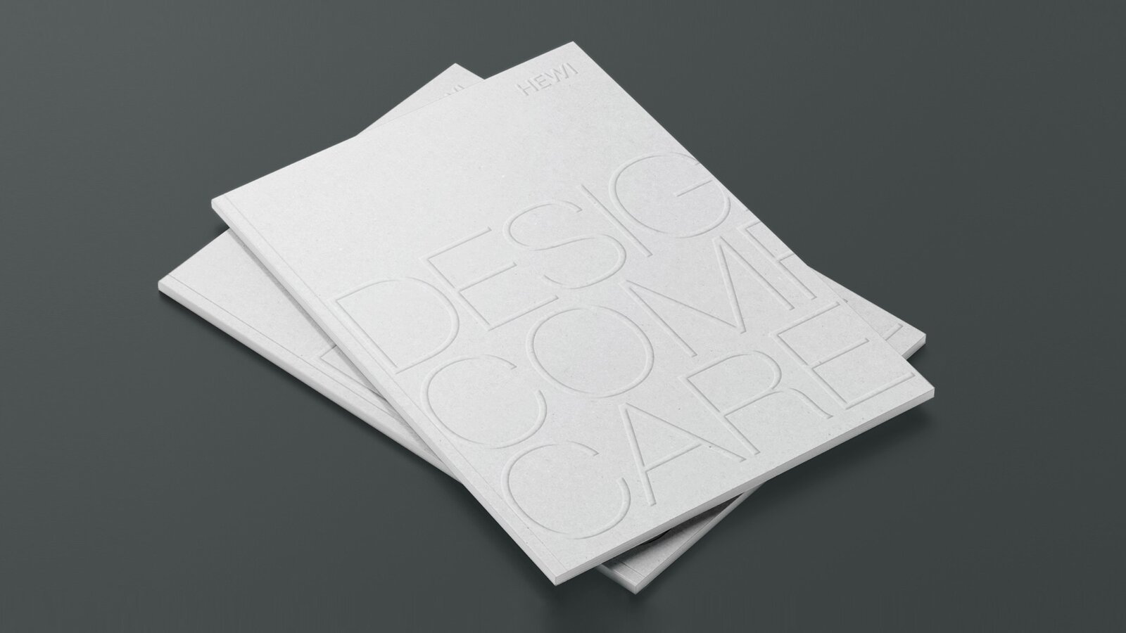 Design Comfort Care Dwie ułożone w stos broszury oznaczone jako Design Comfort Care